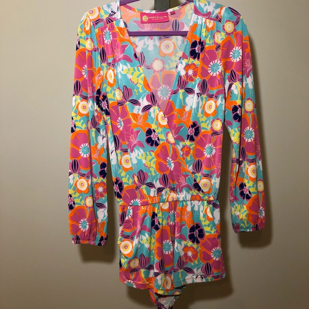 Bright floral long sleeved romper.